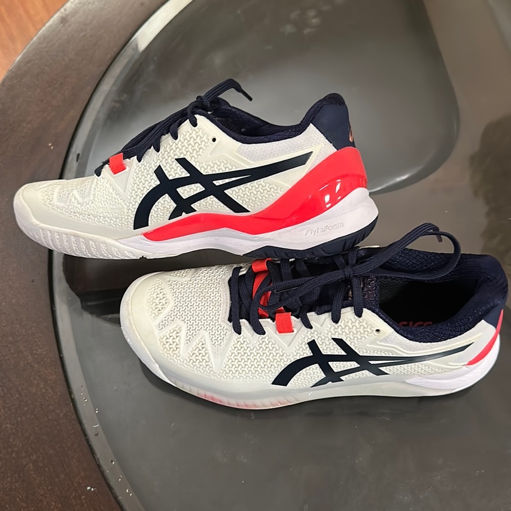 This tennis shoes have a long toe bed. Worn around the house only.